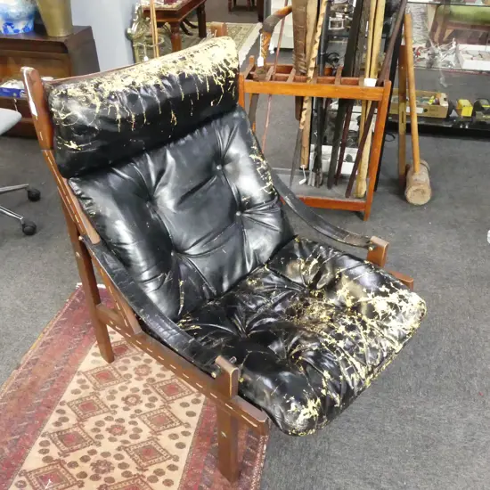 BACKHOUSE LEATHER SAFARI CHAIR black finish showing wear
