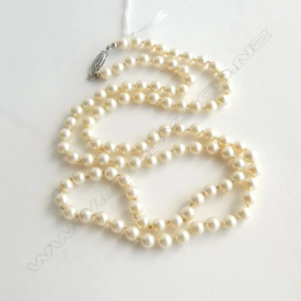 LONG STRAND UNIFORM CULTURED PEARLS individually knotted silver clasp. L.660mm. 6.2mm dia. Image 1++
