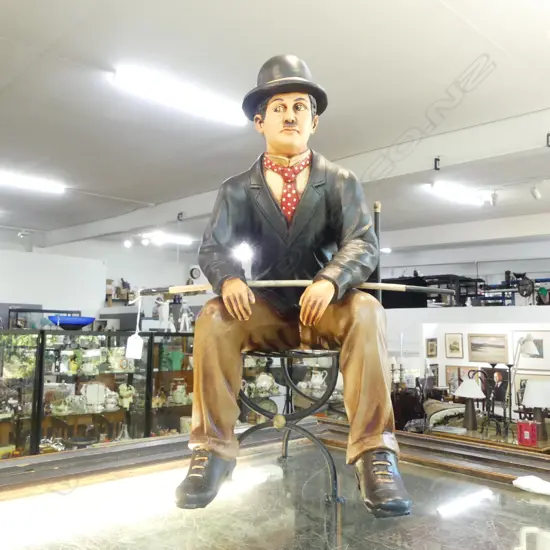 PAINTED RESIN CHARLIE CHAPLIN ON METAL CHAIR H.600mm