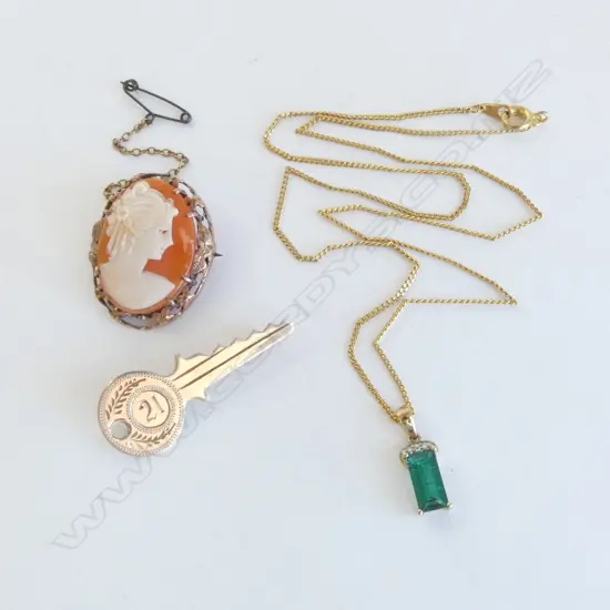 9ct 21st KEY, 9ct CAMEO BROOCH & 9ct GREEN BYRON EMERALD DIAMOND PENDANT ON ROLLED GOLD CHAIN aprox.10gms