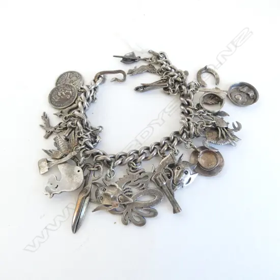 VINTAGE SILVER CHARM BRACELET NZ charms Including some Patoni (Tony Buller) charms + others