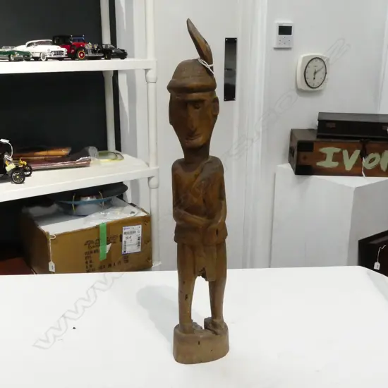 VINTAGE INDONESIAN CARVED WOOD FIGURE WITH FEATHER to his hat. H.530mm.