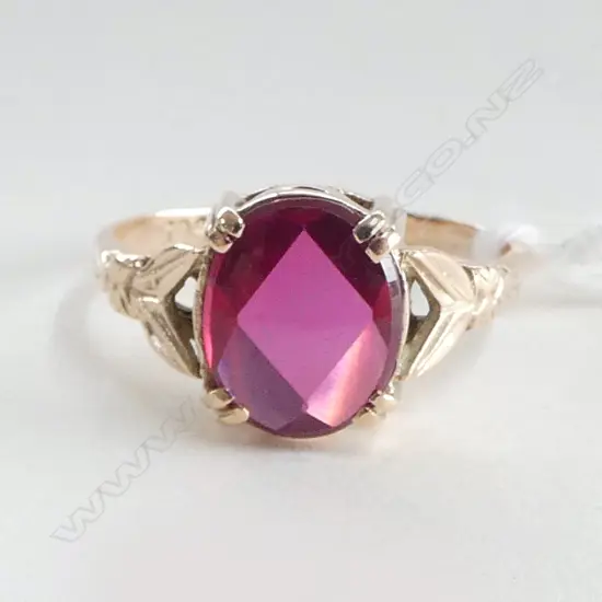 9CT ROSE GOLD AND SYNTHETIC RUBY RING (VALUATION)  3.60gm SIZE P