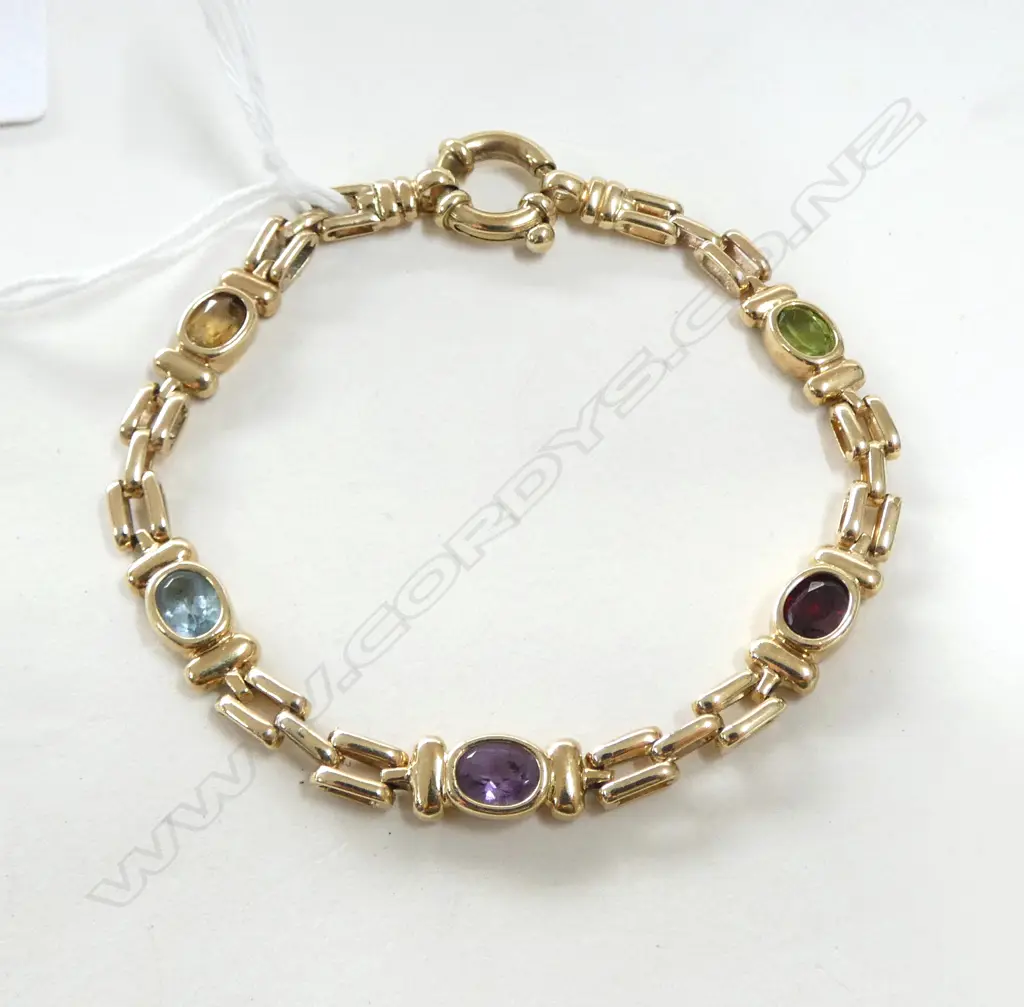 9CT GOLD AND MULTI-STONE BRACELET (VALUATION) 13.73gm Image 1++