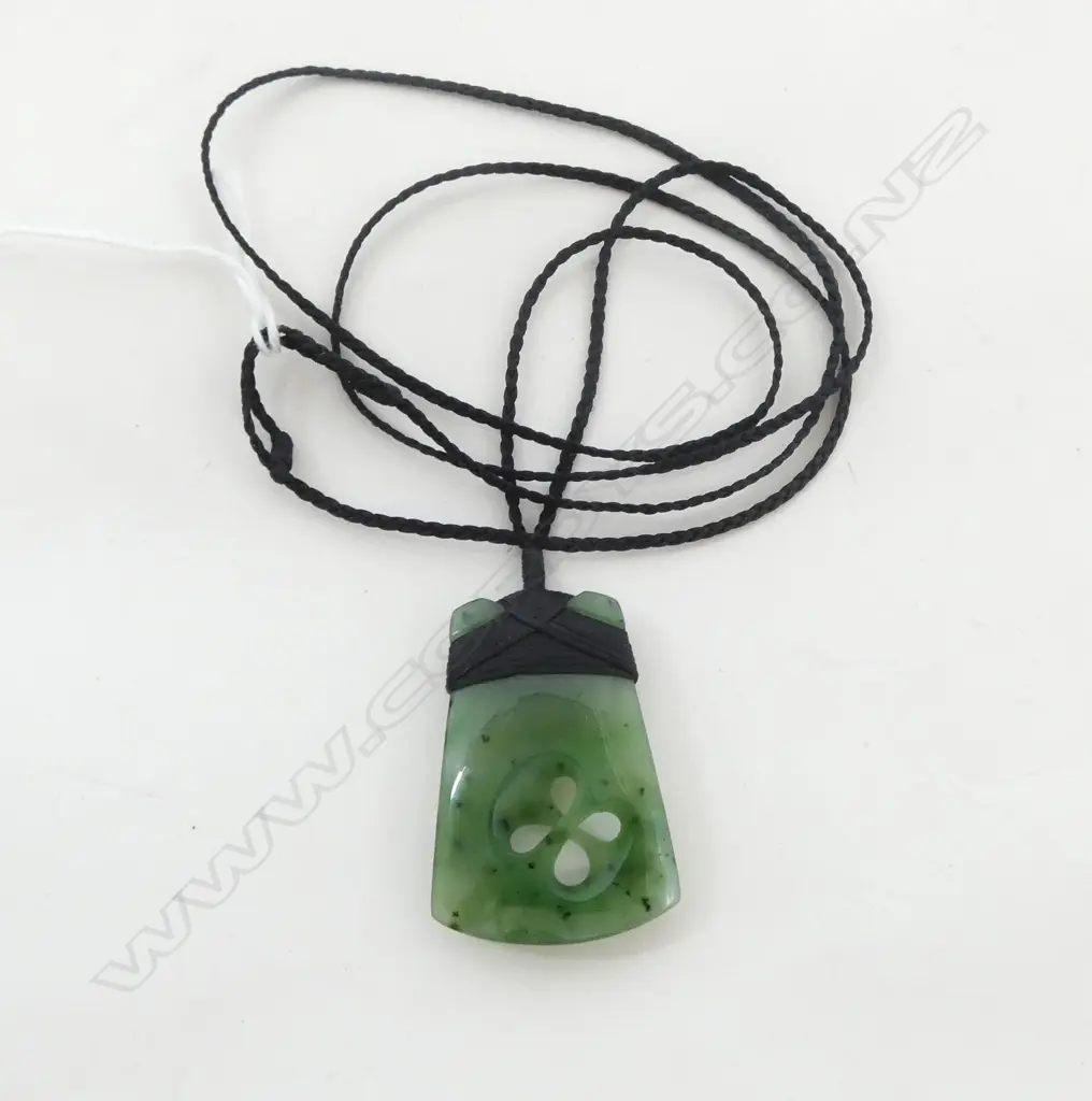 POUNAMU PENDANT toki form with carved cross-over design on plaited cord necklace Image 1++