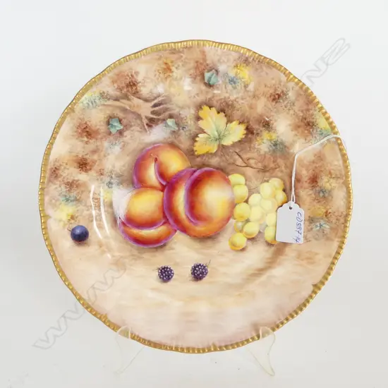 A fruit painted plate by Gerald Delaney