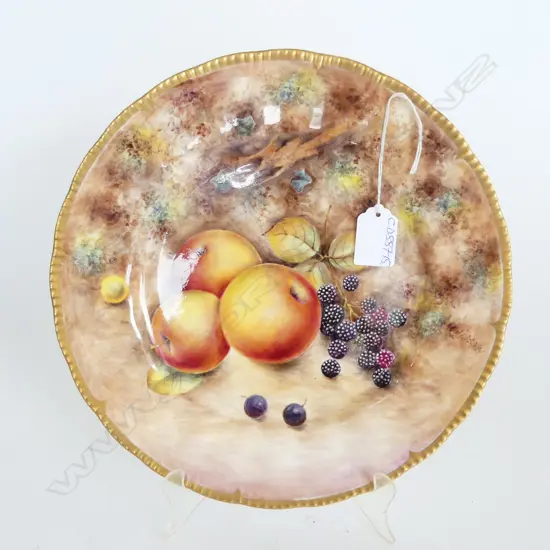 A fruit painted plate by Gerald Delaney