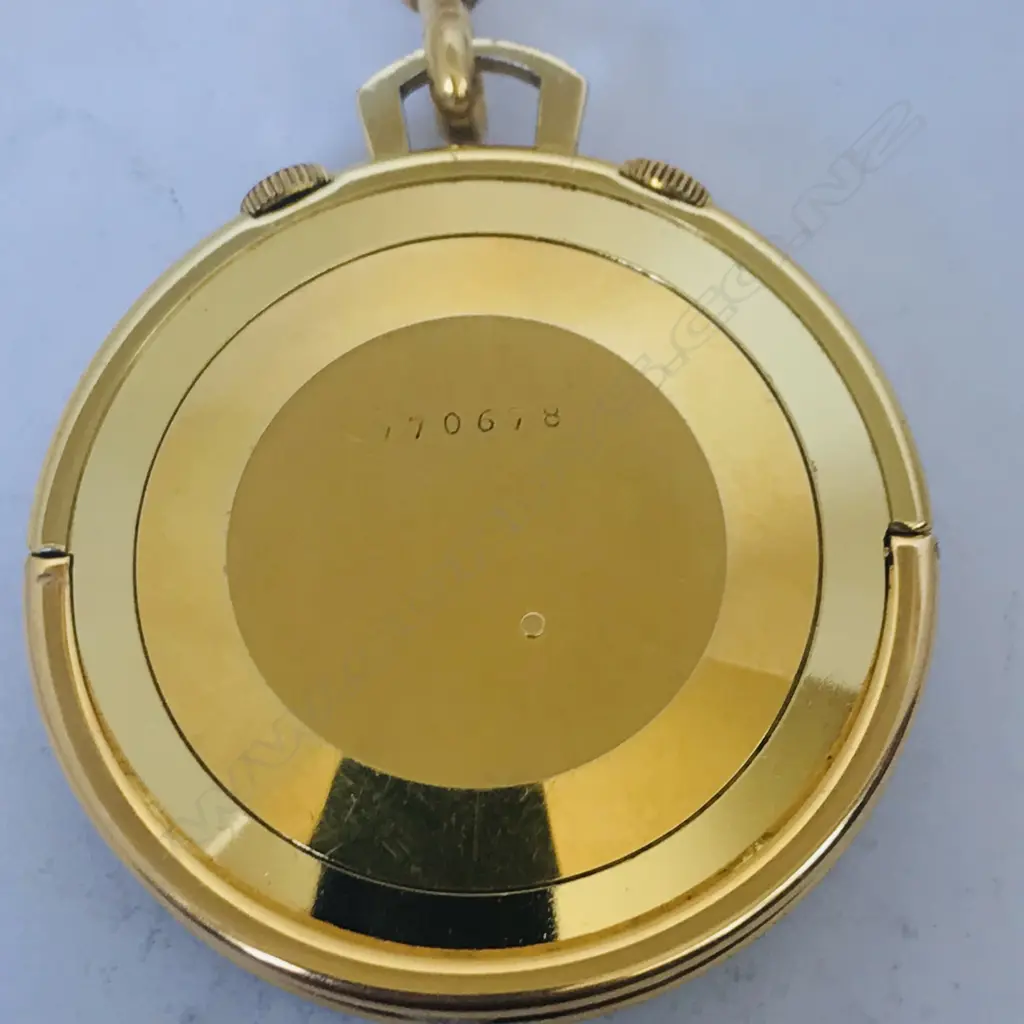 A Jaeger leCoultre 'Memovox' gold plated pocket travel watch, c.1956, with 18ct gold chain. Image 1++