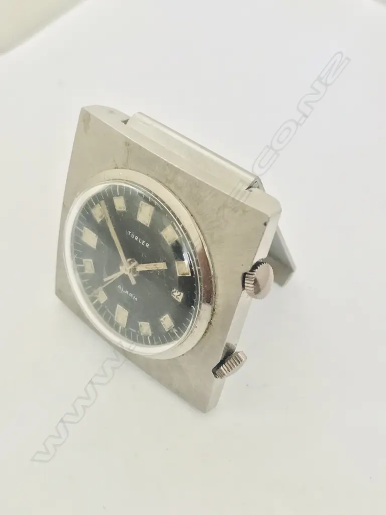 Swiss Türler small travel alarm clock with folding easel back. Image 1++