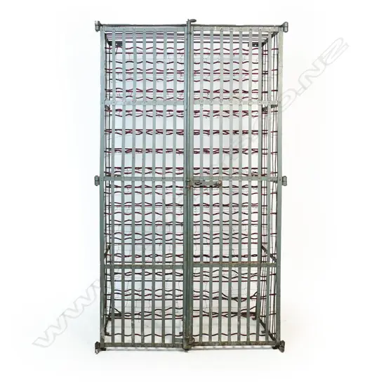 An old wrought iron multiple wine rack with  two lockable 'gates',