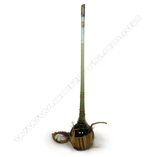 A vintage tall long neck chianti bottle,