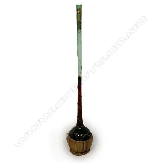 A vintage tall long neck chianti bottle,