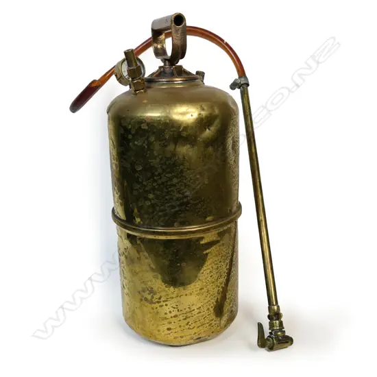 A vintner’s old brass portable sprayer. incorporating pressure gauge,