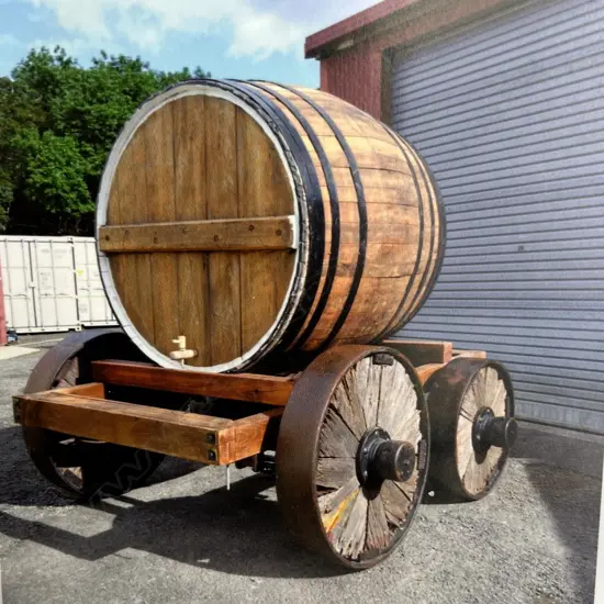 An extra-large 2000 ltr early New Zealand totora promotional barrel on wagon,