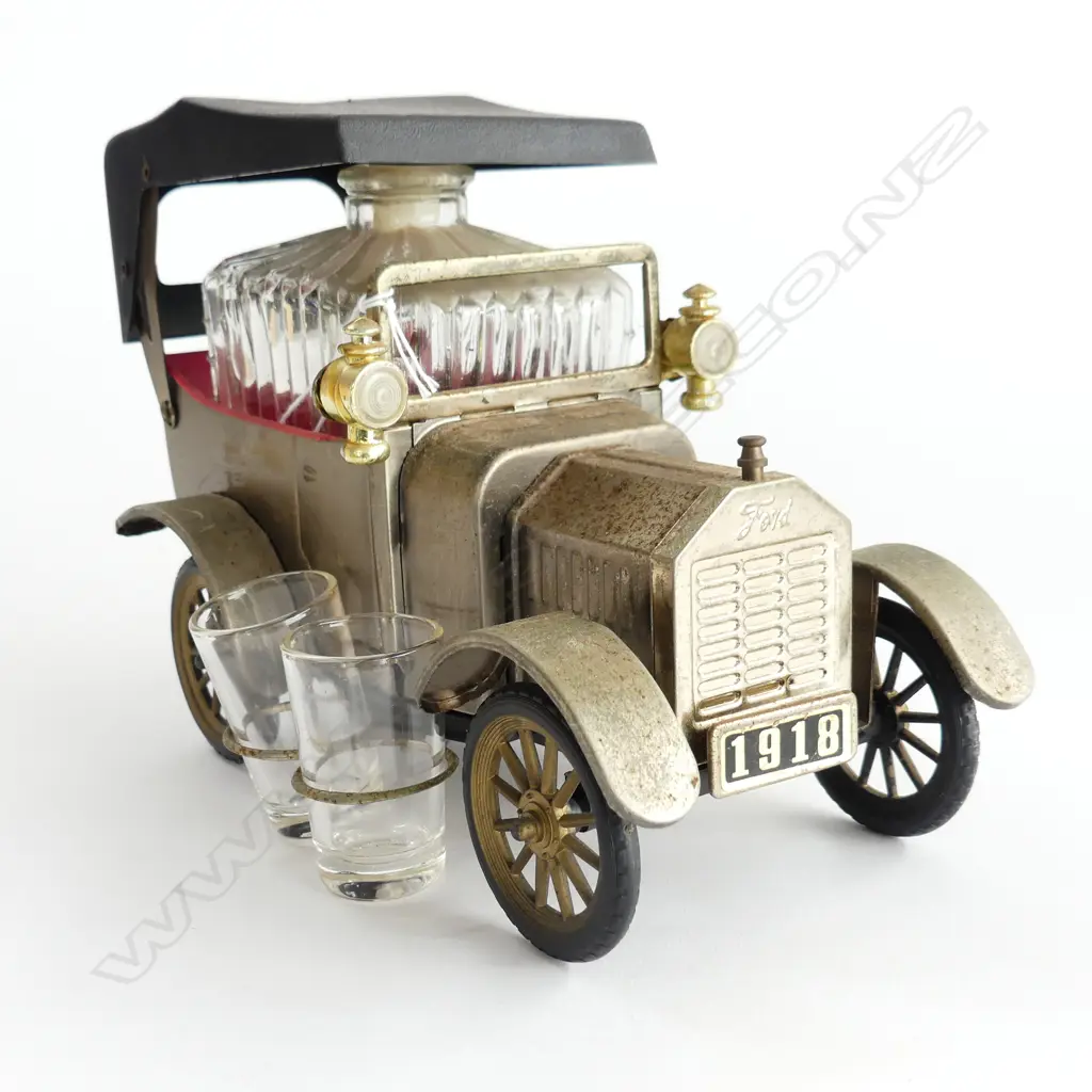 A Ford Motor car with four glasses and decanter inside, Image 1++