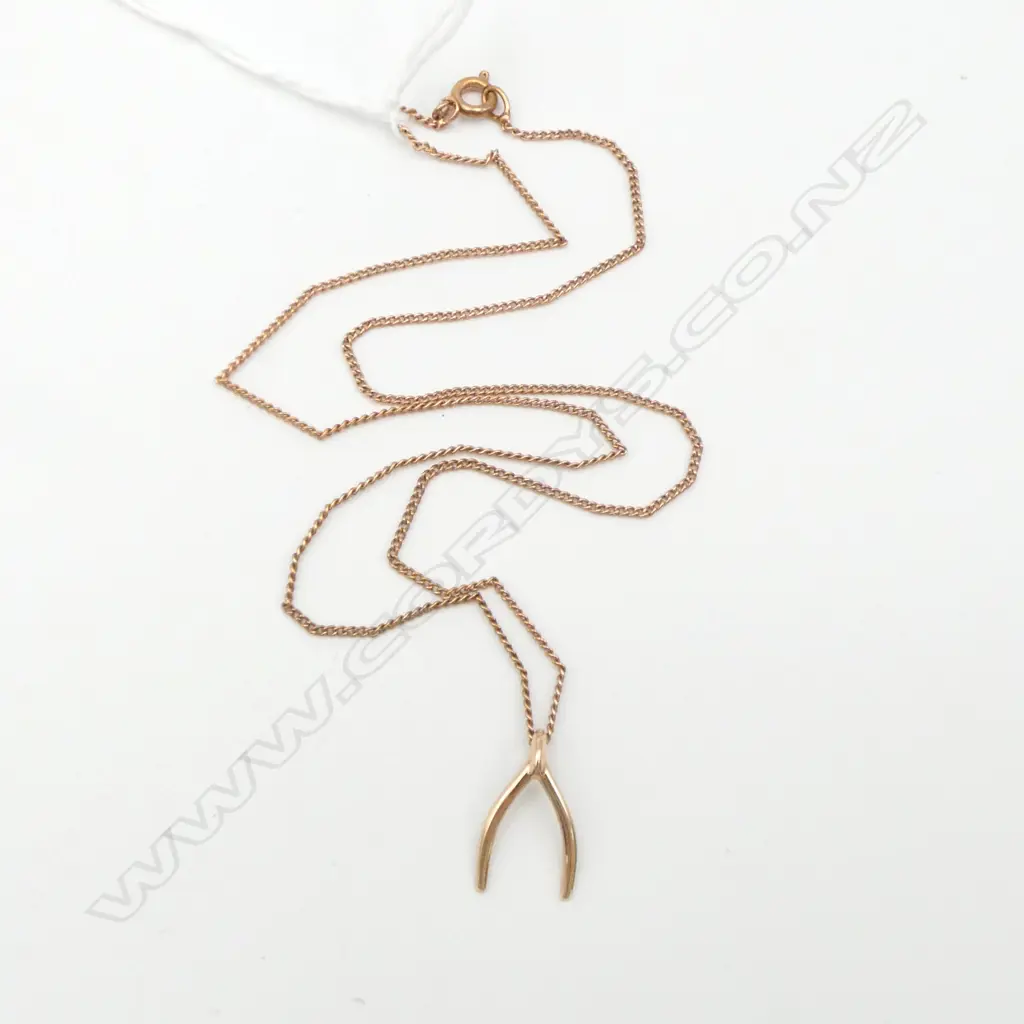 9ct GOLD WISHBONE PENDANT on rolled gold chain 0.49gms Image 1++