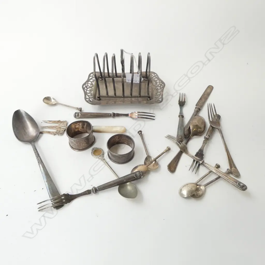 STG SILVER CUTLERY (7 SOLID + 2 NAPKIN RINGS 136gms) + 7 PARTIAL STG + EP TOAST RACK & 2 SPOONS Image 1++