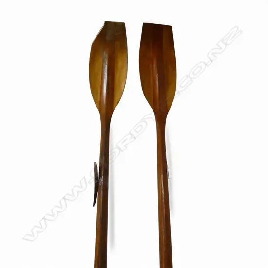 Pair of old long rowing skiff oars ( tip of 1 oar broken off but piece attached). Lacquered Oregon pine ?