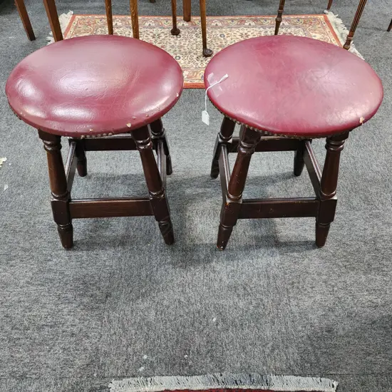 HEAVY PAIR OF VINTAGE WOODEN STOOLS – DARK WOOD WITH RED UPHOLSTERED SEATS 