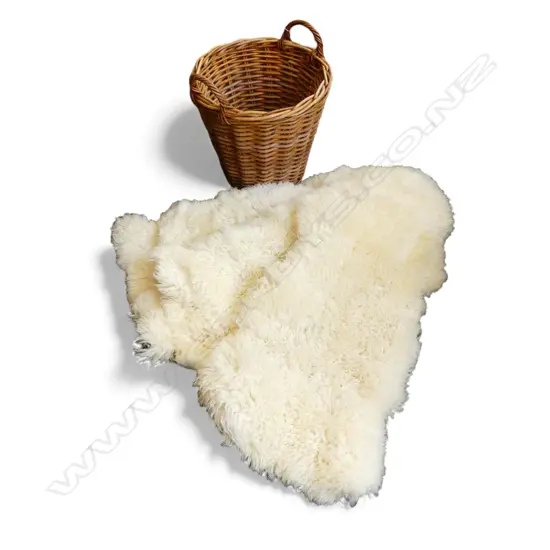 4 WHITE SHEEPSKINS IN WOVEN CANE BASKET H.480mm