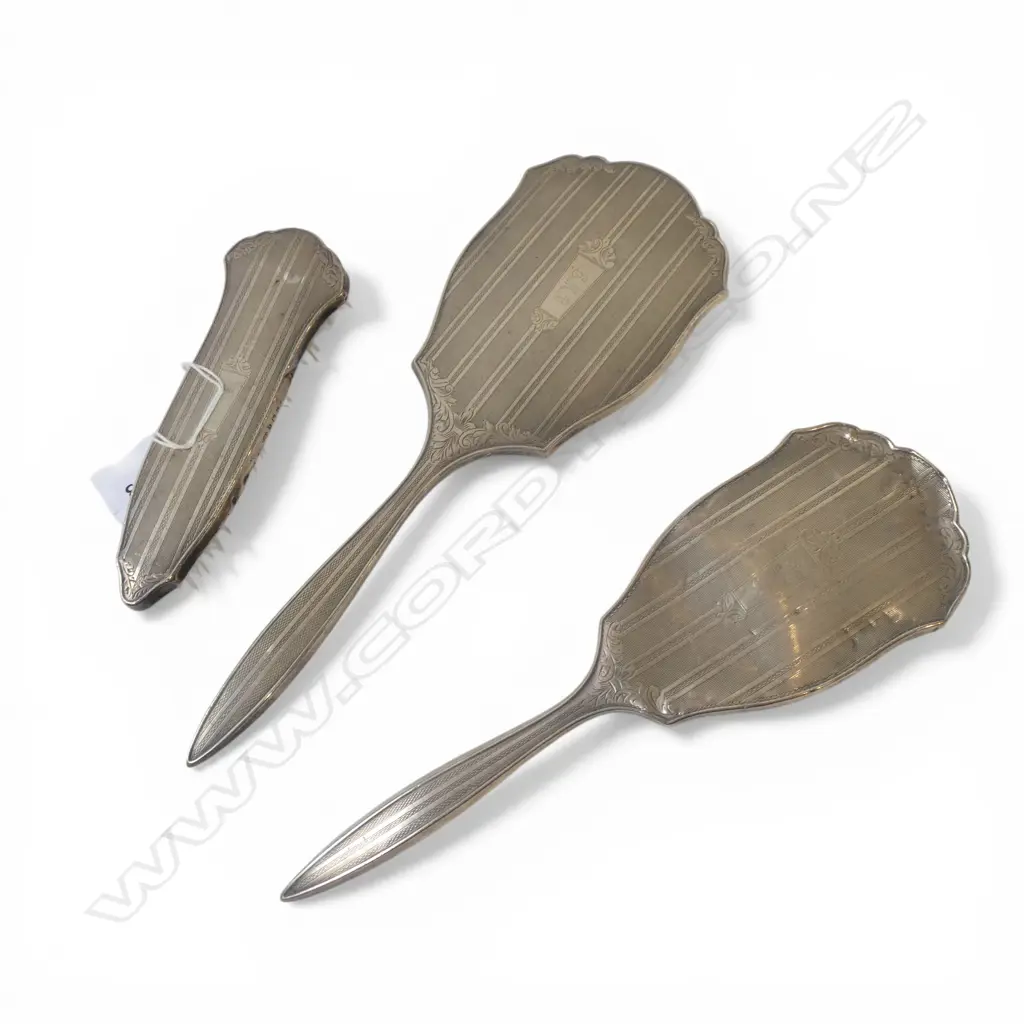 3 SILVER BACKED VANITY ITEMS. Machine engraved. 2 brushes + hand mirror. Birmingham 1957  Image 1++