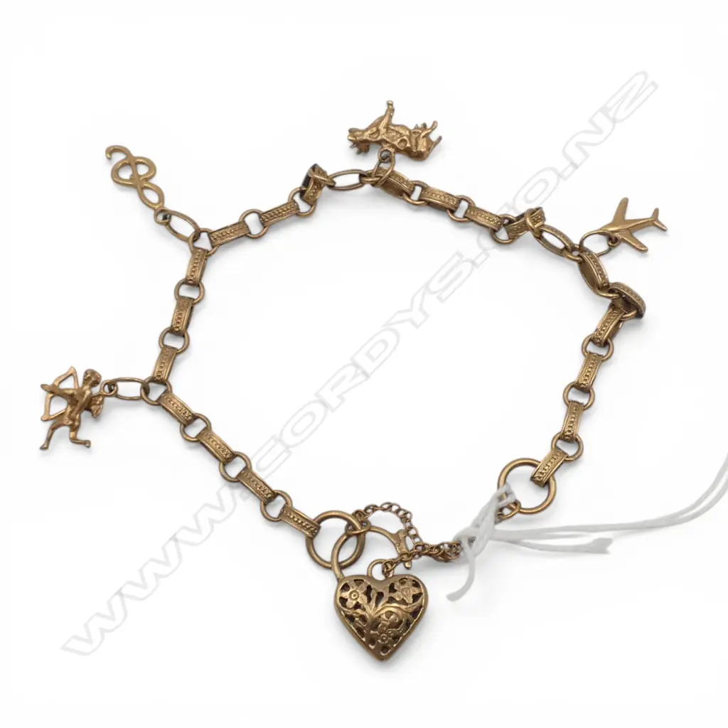 9ct GOLD VINTAGE CHARM BRACELET cupid + plane + cow etc. 14gms Image 1++