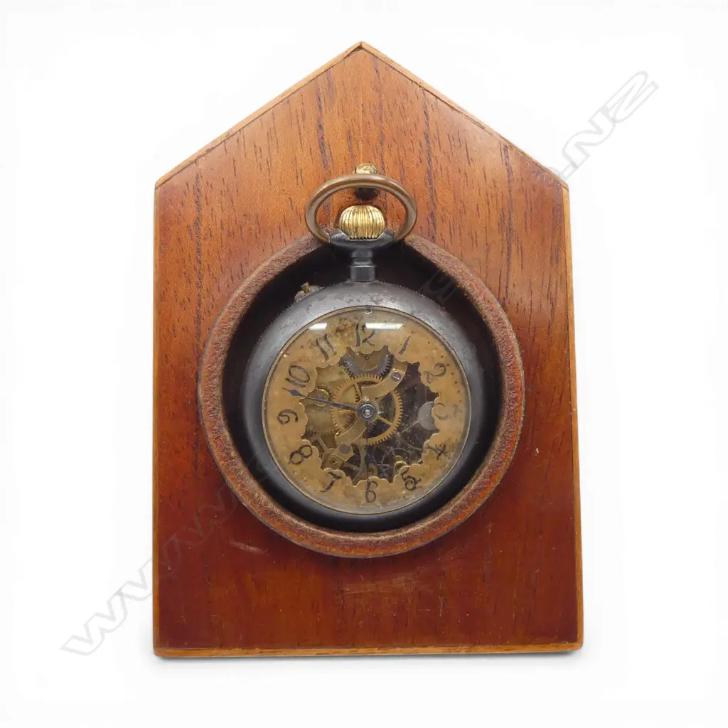 Early 20thC Swiss skeleton pocket watch exhibition back. Gun metal case. Running. In wooden stand Image 1++