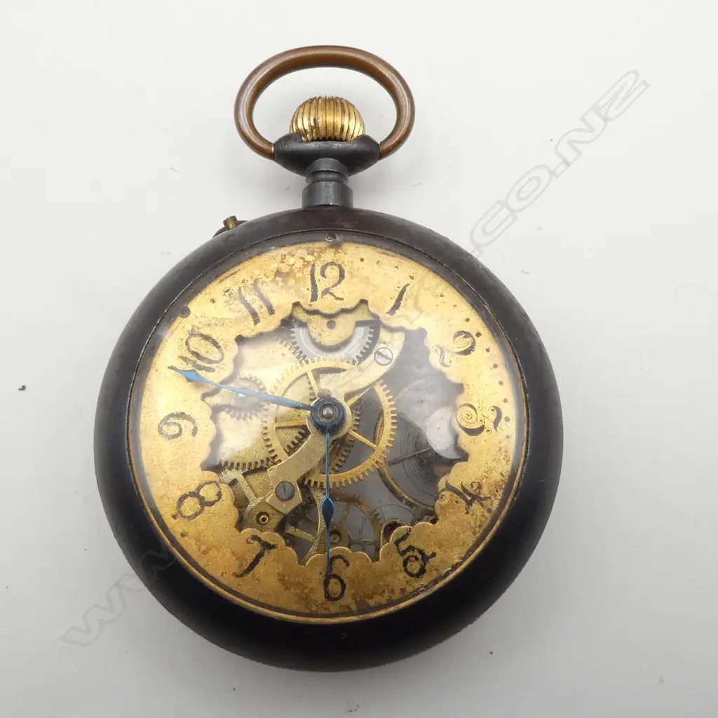 Early 20thC Swiss skeleton pocket watch exhibition back. Gun metal case. Running. In wooden stand Image 1++