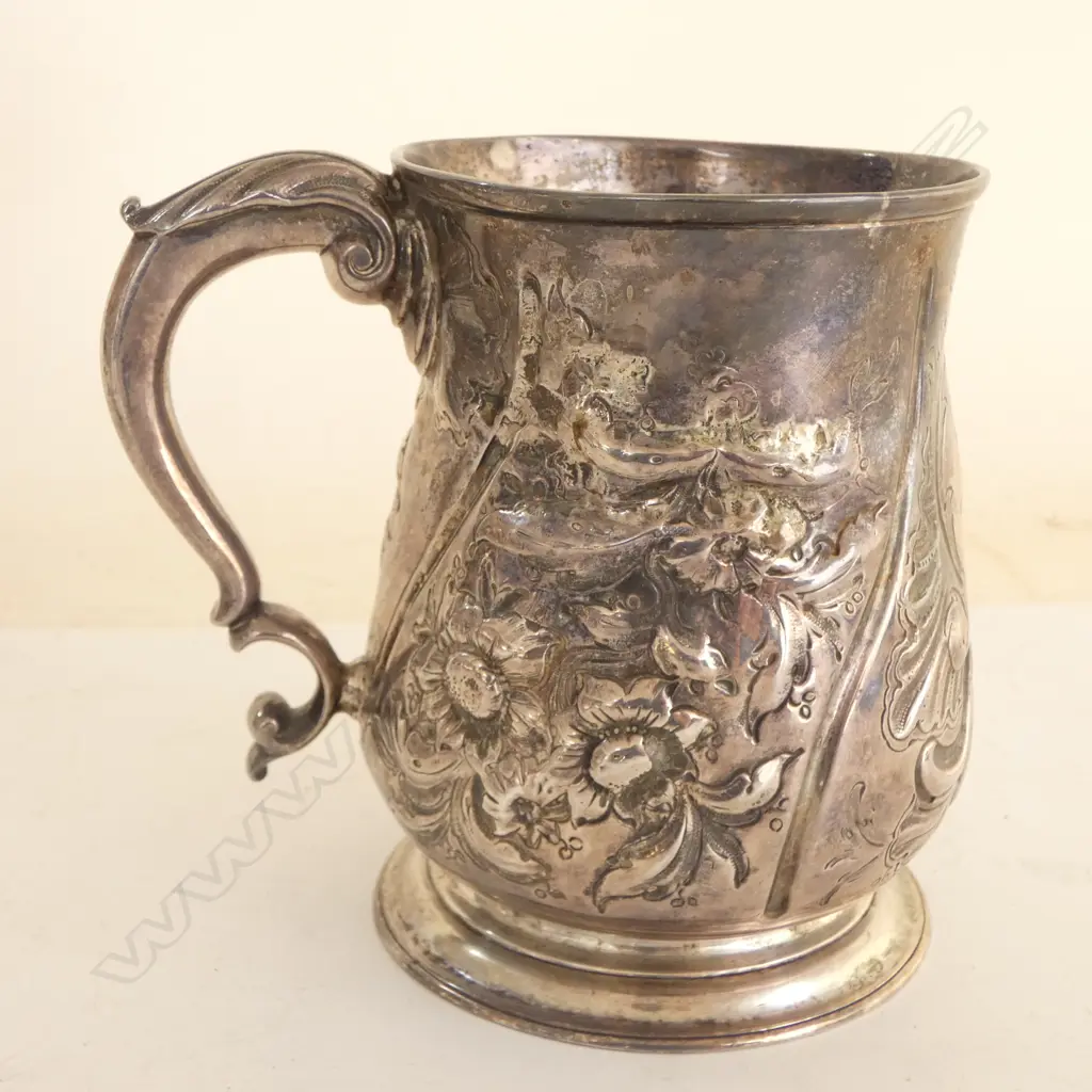 #George III silver embossed baluster mug. London 1739 by Thomas Farren. Some old repair. 348gms  Image 1++