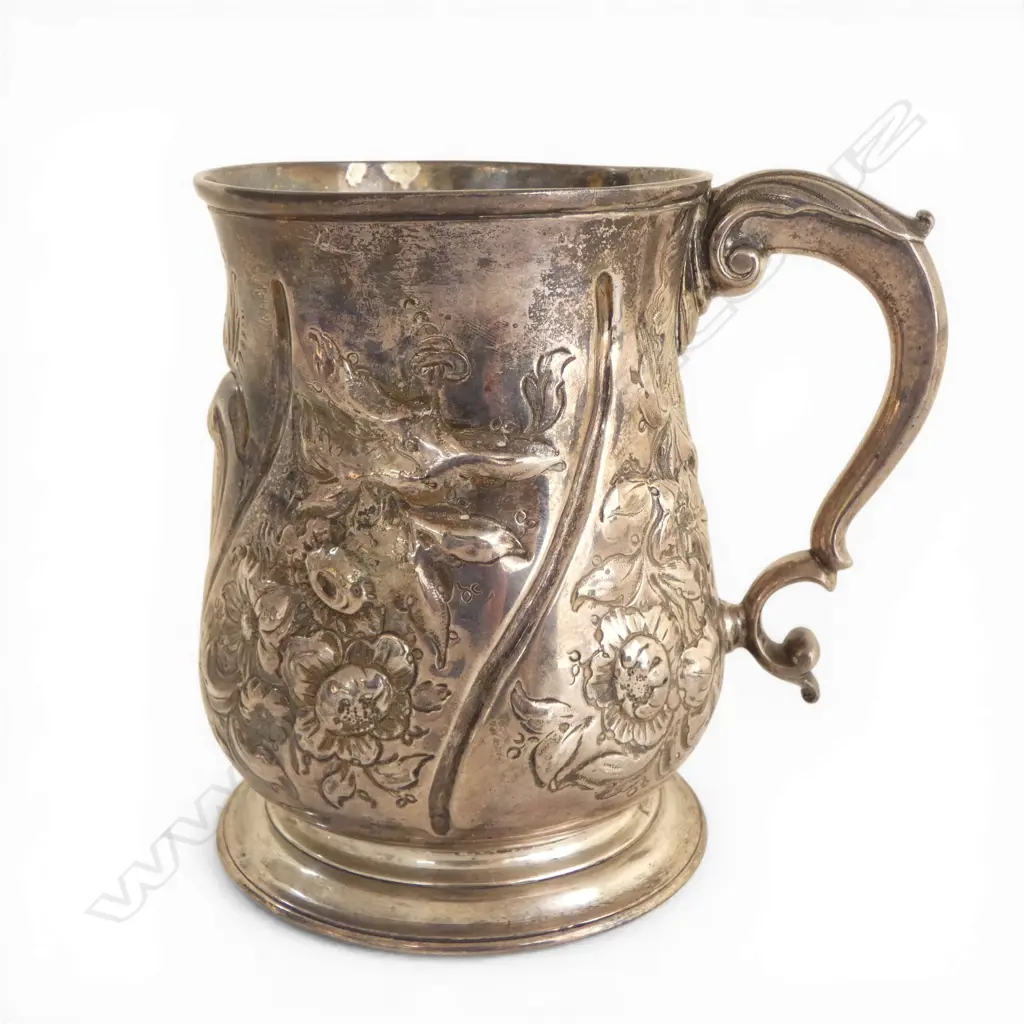#George III silver embossed baluster mug. London 1739 by Thomas Farren. Some old repair. 348gms  Image 1++