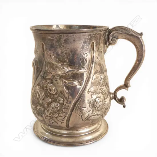 #George III silver embossed baluster mug. London 1739 by Thomas Farren. Some old repair. 348gms 