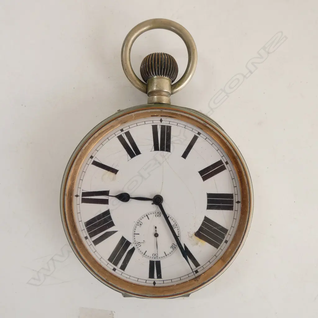 A very large Victorian period silver cased pocket watch stand enclosing a large chrome pocket watch Image 1++