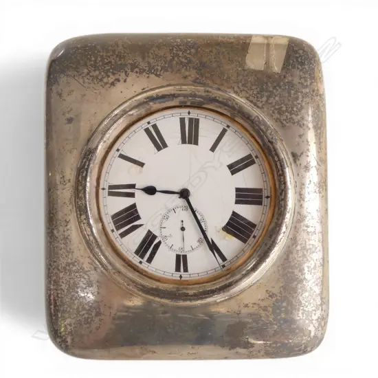 A very large Victorian period silver cased pocket watch stand enclosing a large chrome pocket watch