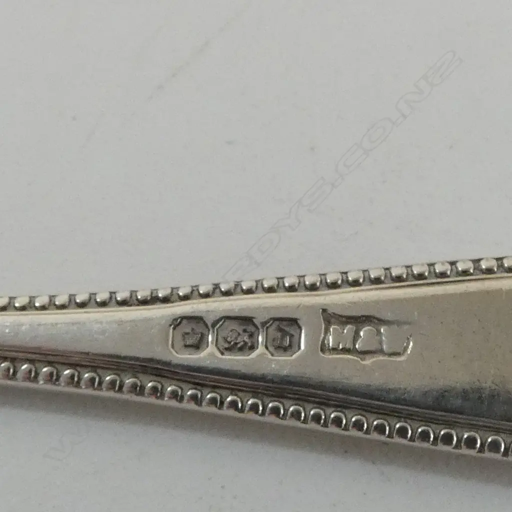 ASST STG SILVER: 4 SPOONS + 2 NAPKIN RINGS 77gms + small silver vase w weighted base 41gms Image 1++