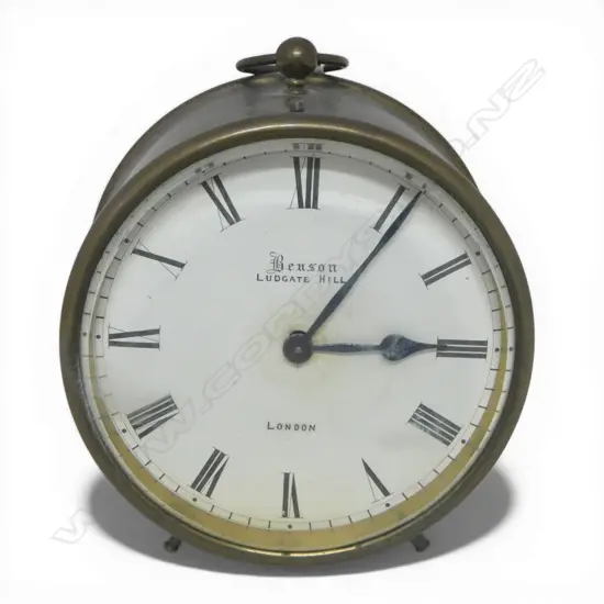 EARLY 20thC BENSON (London) BRASS CASED DESK CLOCK. Quality running brass movement. Enamelled dial. With key. Dia.97mm.