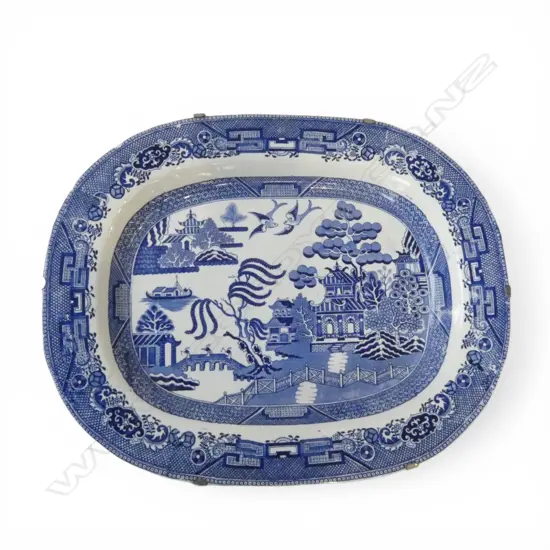 ANTIQUE STAFFORDSHIRE WILLOW PATTERN ASHET mounted in a wooden frame W.460mm