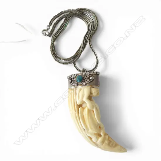 CARVED MARINE IVORY TOOTH WITH SILVER MOUNT (TESTING 91 %) ON PLATED CHAIN L.100mm