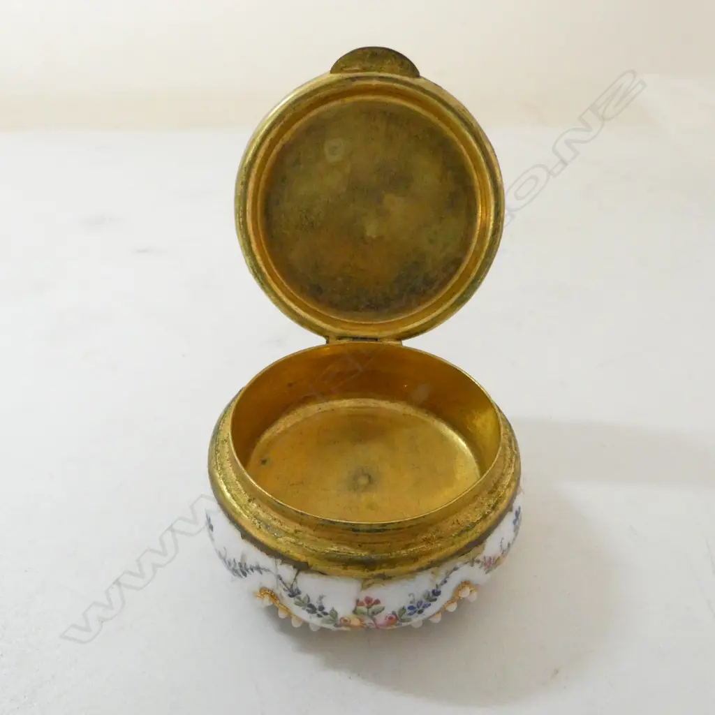 19thC French Limoge enamel patch box with fine painted floral swags and pearl type highlights. Dia.45mm. Image 1++