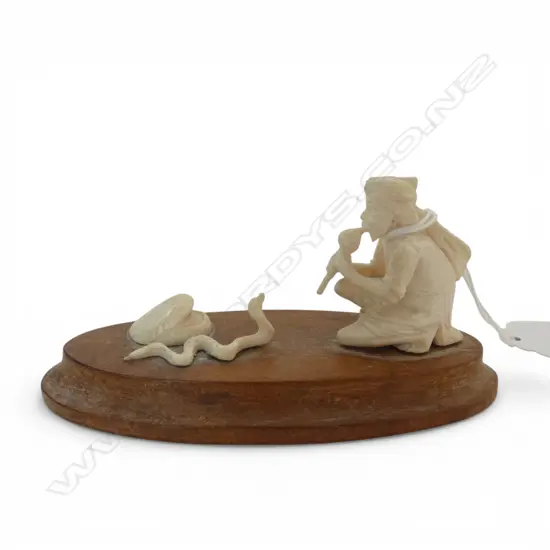 VINTAGE INDIAN carved ivory SNAKE CHARMER on wooden base. L.105mm