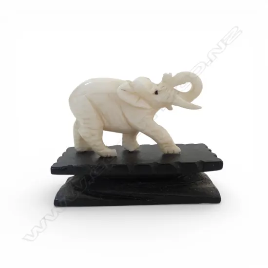 OLD SMALL IVORY CARVED ELEPHANT trunk raised. On base wood base.45mm