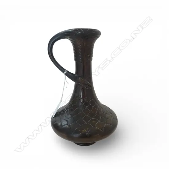 JAPANESE MEIJI BRONZE STORK HANDLED VASE. Fish scale detail to the spreading base. H.220mm