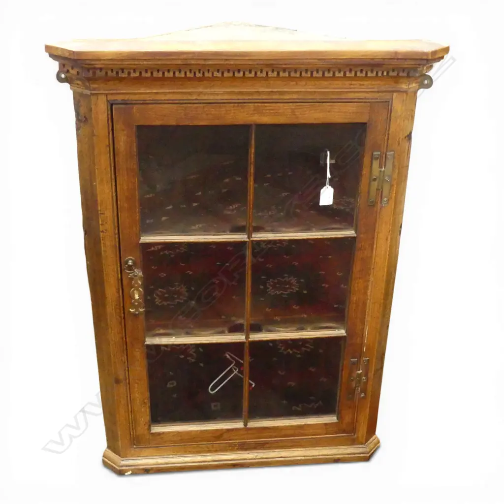 GEORGE III OAK HANGING CORNER CABINET six panel glazed door. Dentilled cornice. H.875mm Image 1++