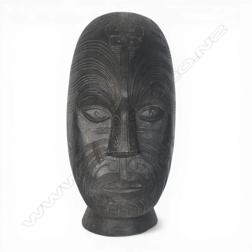 Two light weight wood Maori masks. Dark stained. H.315mm longest. Image 1++