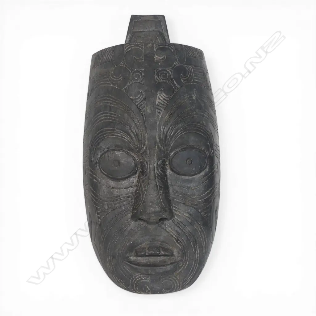 Two light weight wood Maori masks. Dark stained. H.315mm longest. Image 1++