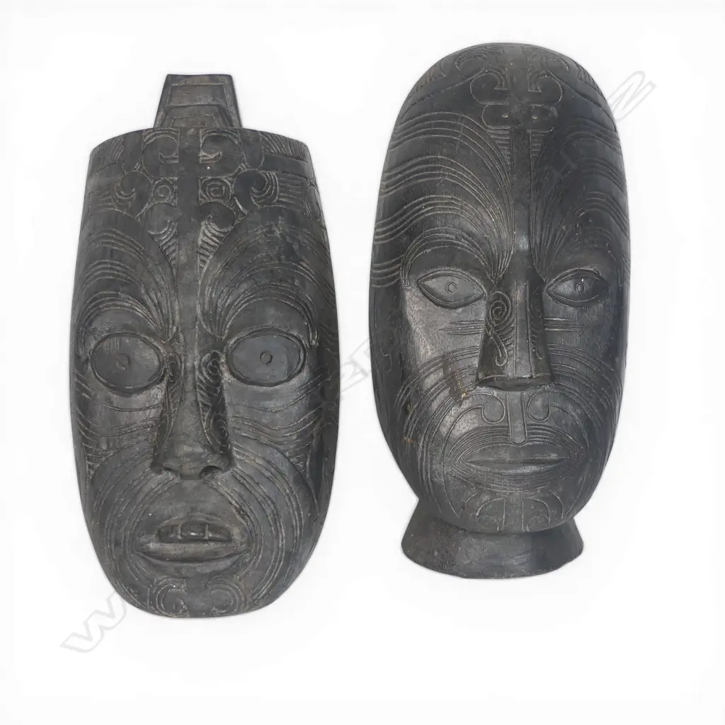Two light weight wood Maori masks. Dark stained. H.315mm longest. Image 1++