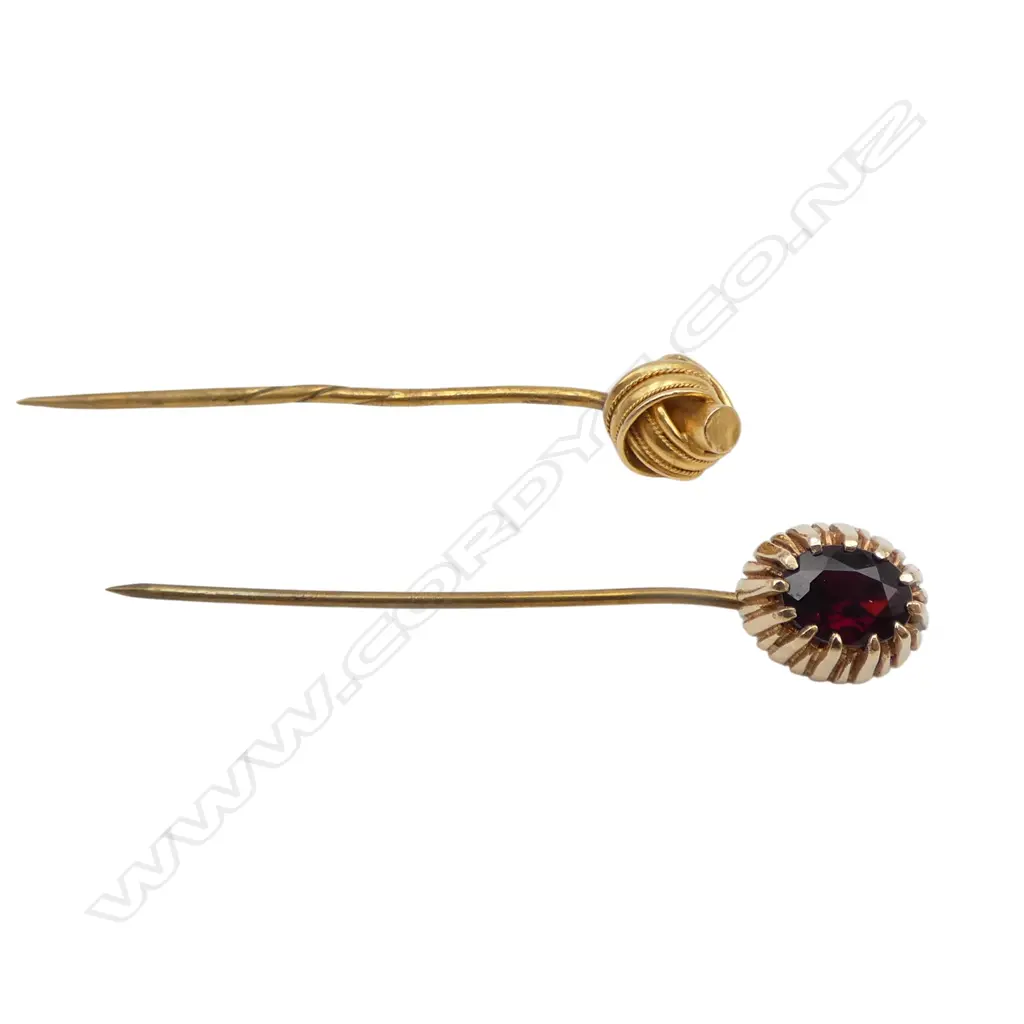 2 STICK PINS; 9CT GARNET STONE 4gms, 18CT KNOT both pins are PLATED 1.6gms Image 1++