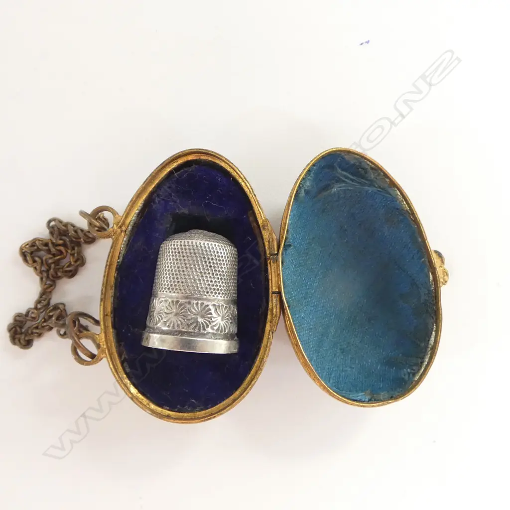 STG SILVER THIMBLE IN BRASS EGG CASE Image 1++