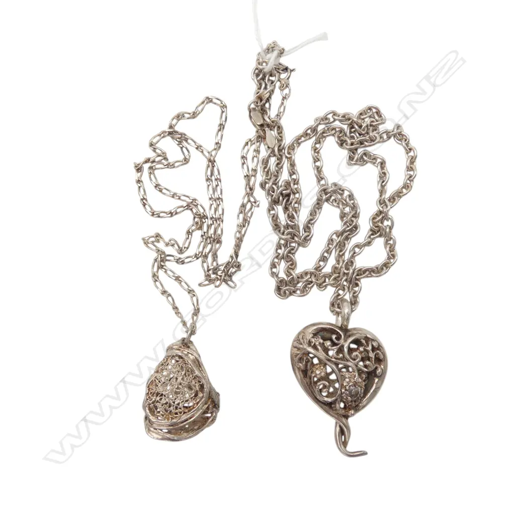 TWO STERLING SILVER PENDANTS AND CHAINS From the estate of jeweller Simon Misdale Image 1++