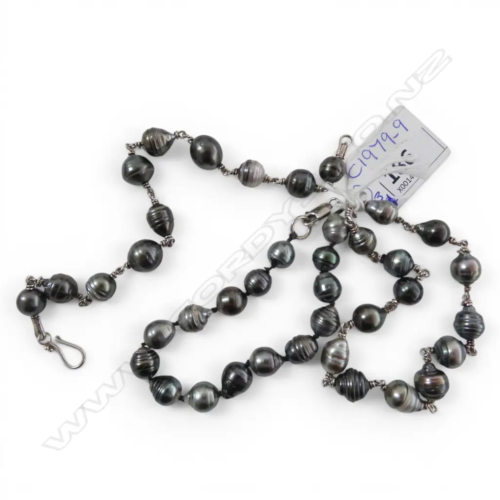 THREE BAROQUE BLACK PEARL BRACELETS From the estate of jeweller Simon Misdale Image 1++