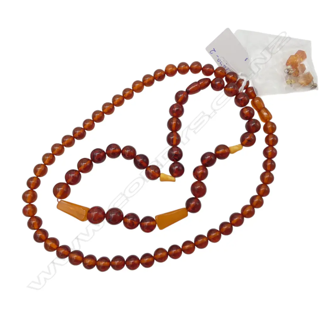 TWO AMBER BEAD NECKLACES AND A PAIR OF EARRINGS From the estate of jeweller Simon Misdale Image 1++